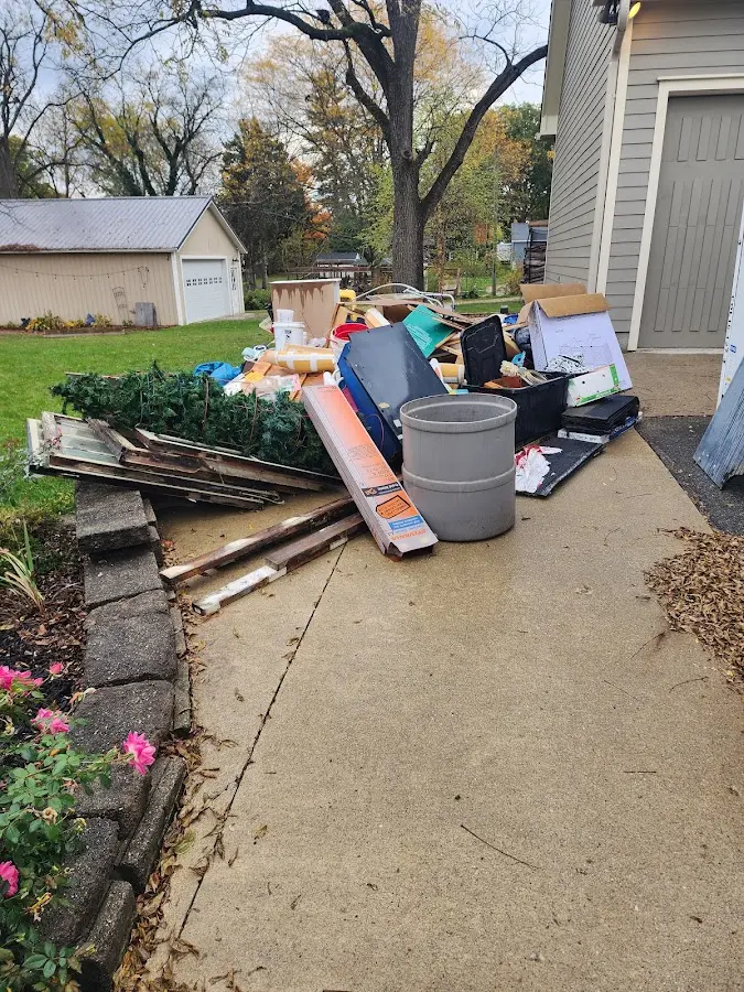 Dumpster being loaded with debris for Residential Dumpster Rental in Dock Junction